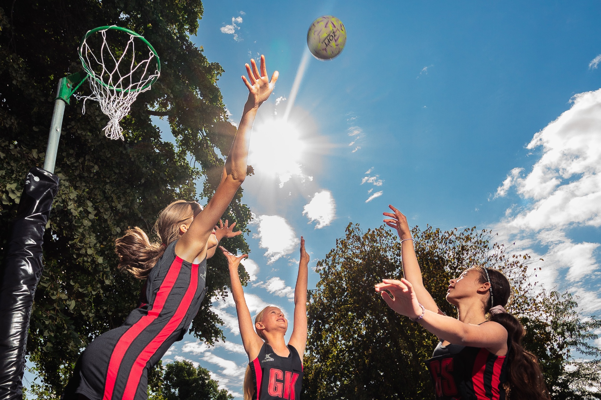 Senior Prep pupils leaping for the ball at the netball hoop